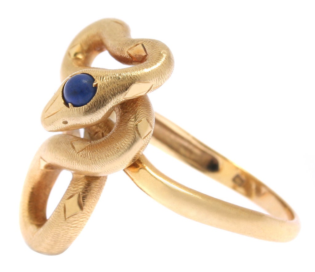 This is a beautiful ring with wonderful detail. The snake head holds a cabachon of lapiz lazuli. The ring size is an 11 and the snake measures 1 1/8