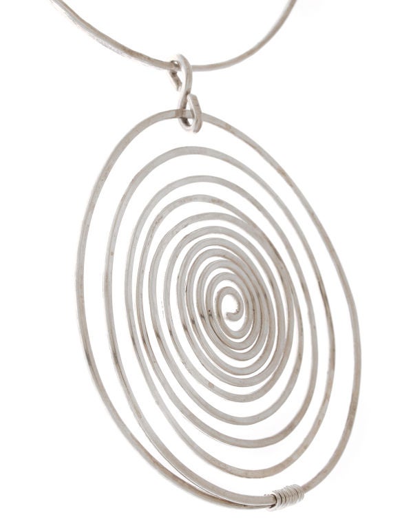 This is a statement making studio piece.  The spiral is not flat, it has a  dimensional quality to it.  The necklace measures 16