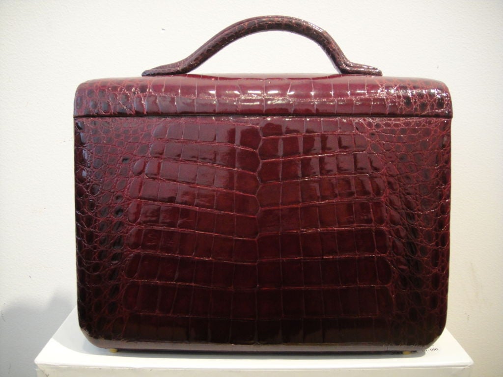 This fantastic Italian-made Lederer travel vanity case in gorgeous burgundy crocodile displays the kind of workmanship impossible to find today in any but the most exclusive pieces!  It features multiple compartments and straps for securing bottles