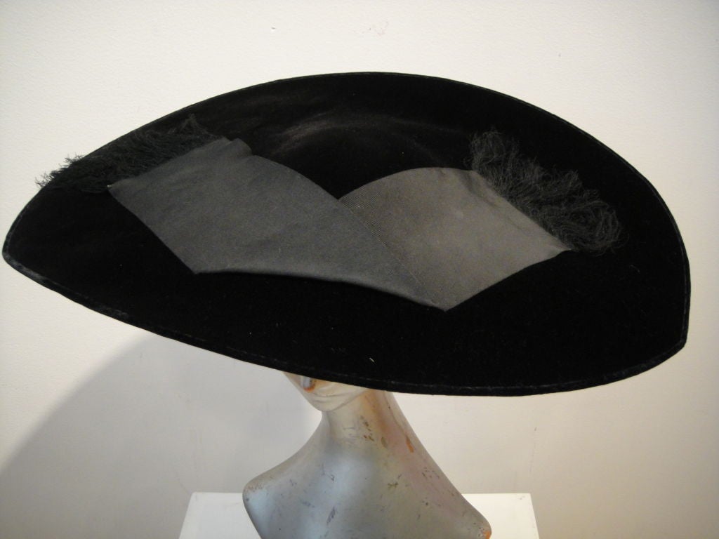 Take flight in this divine aerodynamic 1950's saucer hat from The Emporium!  Reminiscent of the chicest Dior designs from this period, in silk velvet and silk grosgrain ribbon, the cap is lined in gold lame!<br />
<br />
hat measures 18