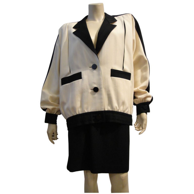 Galanos 1980s sporty two-tone, black/white jacket is a great interpretation of a 1950s Eisenhower style jacket!  Contrasting slash pockets, buttons, collar, waistband along with vents make for great details!