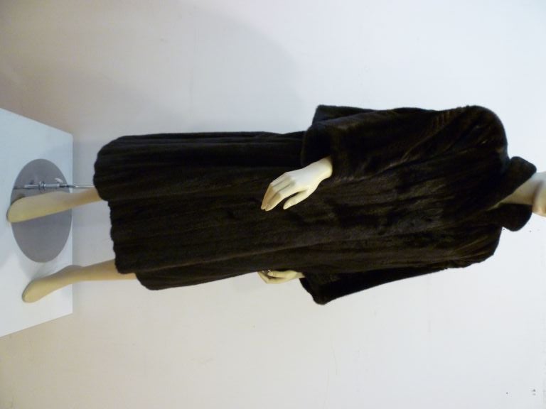 James Galanos for Neiman Marcus 1980s Dolman Sleeve Mink Coat in Black Onyx.  Dark brown full length fur a master designer with a distinctly 80s flair!  <br />
<br />
This coat is meant to be an oversized Medium, but can easily accommodate a Large.