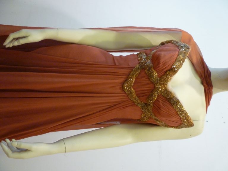 This Haute Couture Fei Zandi strapless Grecian 50s structured gown was custom made in her Paris atelier for a Persian Princess!  Constructed in cinnamon colored ruched silk chiffon with gold beaded braid work applied to the bodice, and flowing