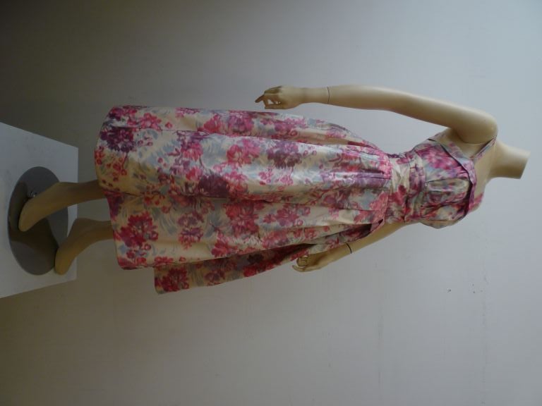 Helen Sjolander 1950s silk floral party dress with wonderful pleating and full skirt!  The floral pattern is rendered in a beautiful and unusual color palette and the skirt is fully interfaced giving it lots of body!