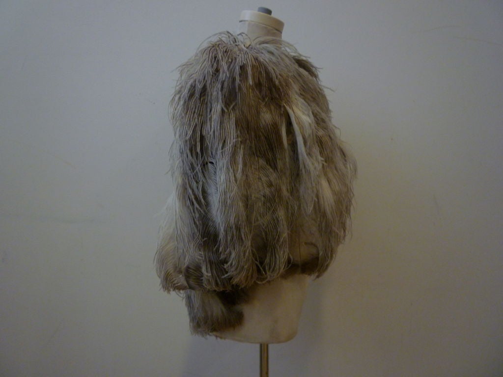This is a beautiful 1930s capelet made of the finest natural colored ostrich feathers!  Wear it over your slinkiest bias cut gown for maximum effect!
