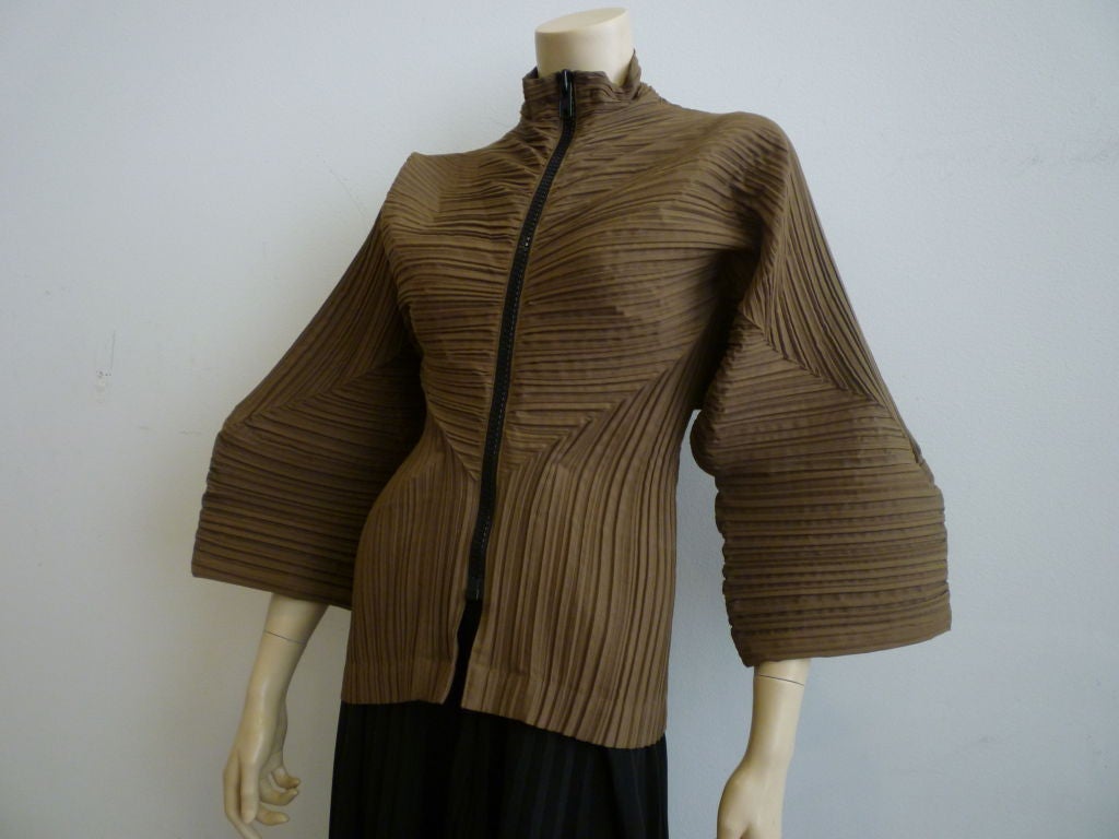 Issey Miyake 1980s iconic pleating in a casual zippered jacket.  Cropped short and waist and sleeves.  Probably a cotton/lycra blend.  <br />
<br />
pictured with Matsuda 1980s pleated leg pants!