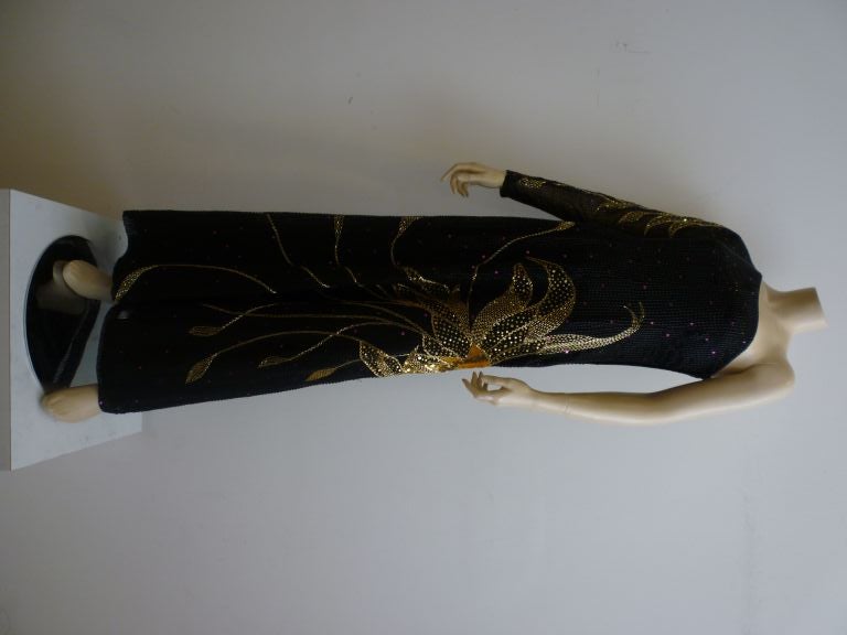 1980s meets Anna Mae Wong!  Tracy Mills dramatic one-shoulder beaded and sequined gown with huge bird wing motif!