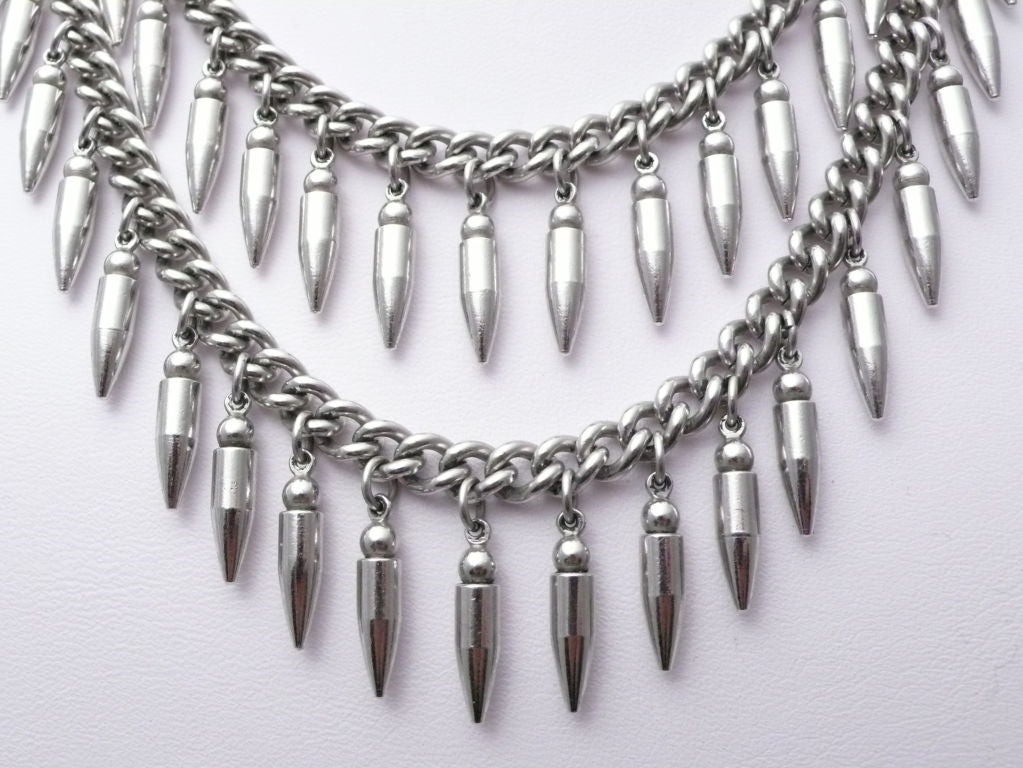Silver tone two-tier bullet necklace.