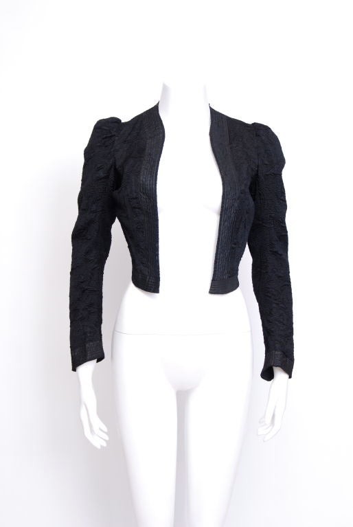 Silk brocade cropped jacket, puffed shoulders, lined in cotton and trimmed with black silk.