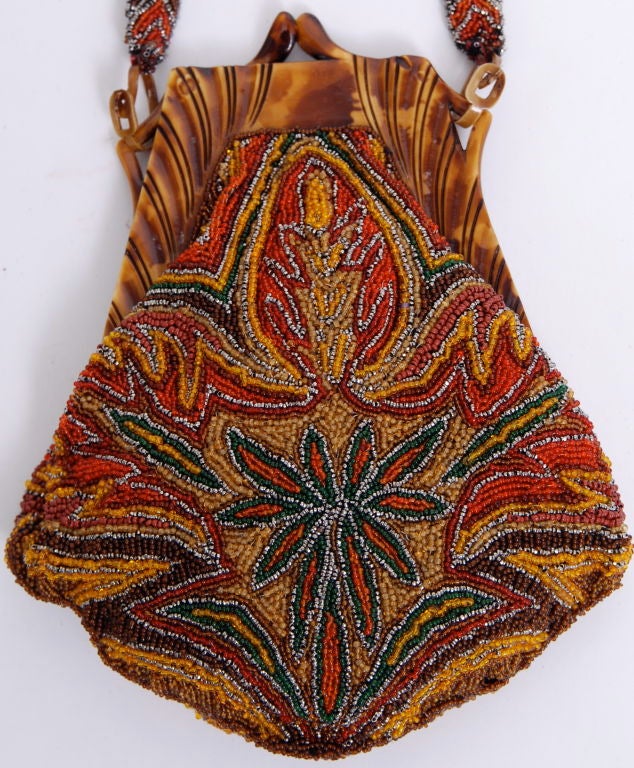 Stunning glass seed beaded 1920's purse with a tortoise colored resin frame closure.