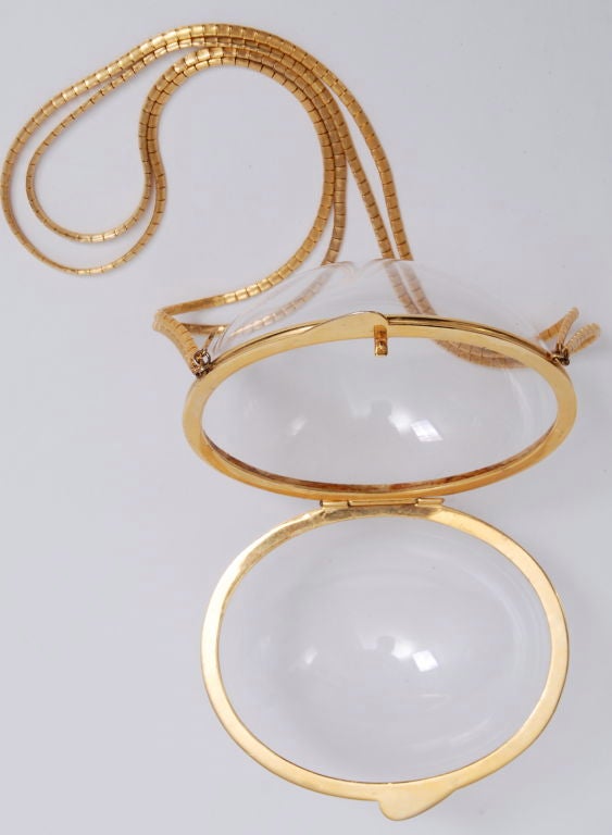 Early , rare judith Leiber gold tone metal and lucite bag. The translucent and lucite trend have great importance for Spring/ Summer 2010 jewelry and accessories. This Lucite bag is a great shape and style and features long gold tone straps.