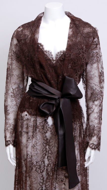 Brown lace Valentino Coat with matching spaghetti strap camisole and leather wrap belt.<br />
Never been worn, tags attached, labeled Valentino.<br />
<br />
Valentino<br />
Born valentino Garavani,Valentino’s international debut took place in