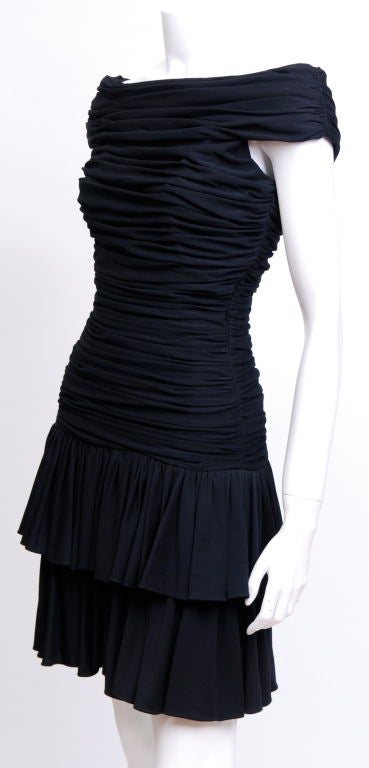 Sexy off the shoulder rouched black silk jersey, knee length dress. Fully lined. Back zipper.