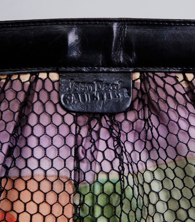 Jean Paul Gaultier floral silk bag with mesh overlay and leather handle. Fully lined in silk with JPG logo pattern.