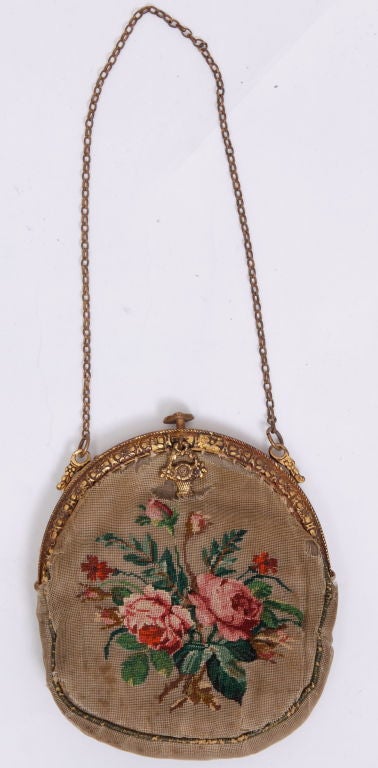 This purse was previously owned by June Carter-Cash and passed down to her grandaughter.  It is intricatetly cross stitched with a lovely floral pattern.<br />
<br />
June was a distinguished singer, songwriter, author, actress, comedian, and