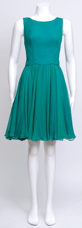 This beautiful chiffon 50's dress is the perfect day to evening cocktail dress worn with or without the matching sequin jacket. The jacket can be worn seperately for another amazing retro look!


