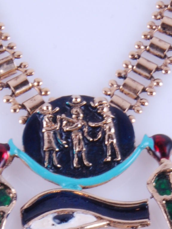 Inspired by the pectoral discovered in Tutankhamun's tomb this spectacular gilded, enameled and faux jewel scarab set necklace is signed in nine places.<br />
<br />
Chain is 16