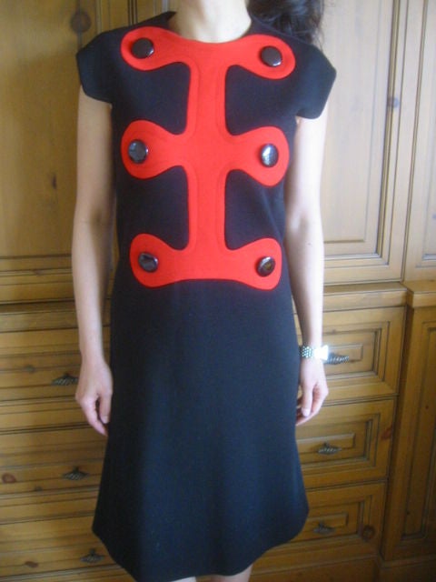 Fabulous vintage Mod dress from Pierre Cardin<br />
<br />
This wonderful dress is made of a what feels like a soft wool blend in a timeless shade of black. Designed with unique sleeves and a the front of the dress has a wonderful pattern
