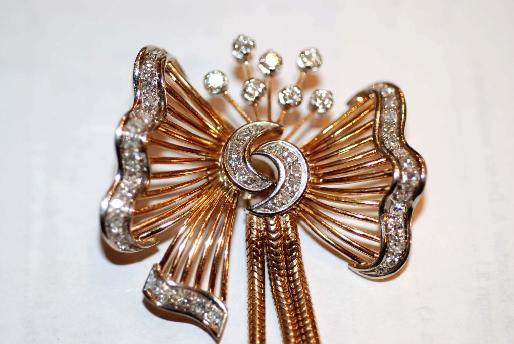 Beautiful Bow Pendant with Hanging Tassels. Contains 1.5 Carats diamonds-VS-SI clarity /G-H color.