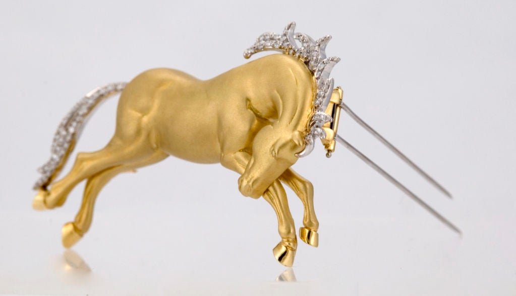 PLEASE VISIT LAUREN STANLEY IN NEW YORK<br />
<br />
An 18 karat gold and diamond pin - brooch - one-of-two-made - by Albert Lipten, of New York, in the form of a wild mustang - horse - most realistic in form, with curved down head, the hoofs