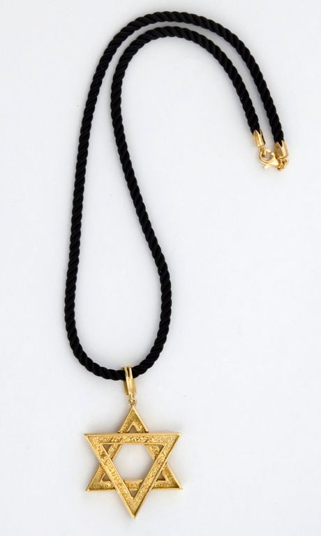 PLEASE VISIT LAUREN STANLEY IN NEW YORK<br />
<br />
An 18 karat gold pendant - necklace - one-of-two-made - by Albert Lipten, of New York, in the form of a six-sided Star of David, the traingles bolted together (see pictures).  Weight 10.54