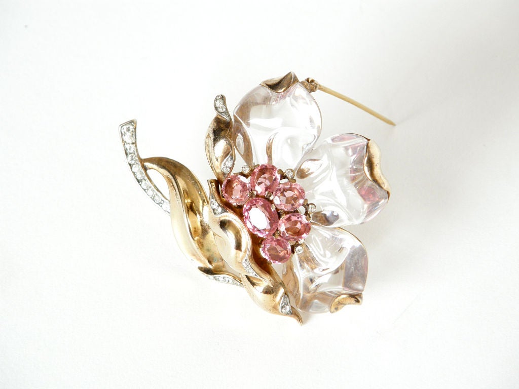 This exquisite flower brooch, designed in 1944, is from a series of jewelry featuring lucite components designed by Alfred Philippe for Trifari. They are commonly referred to as 
