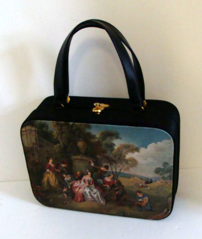 This unusual box purse has a renaissance theme.  The cream color satin interior is fitted with a snap purse and a slip in pocket.  It can be used for day to evening.  <br />
<br />
Its generous interior will hold everything you need for an evening