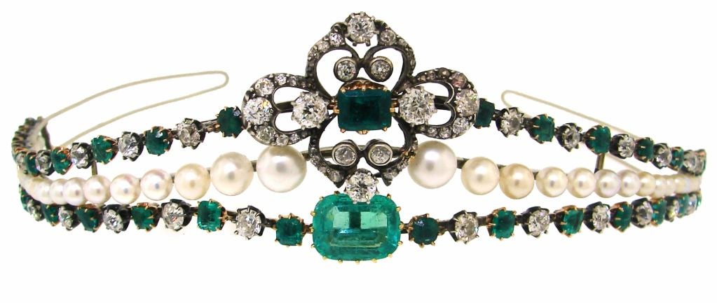 Stunning tiara created in Europe in the 1910's. It is made of gold and silver and tastefully set with emeralds, diamonds and natural pearls. Emeralds are natural, no treatment, no color enhancement.<br />
The tiara is 14 1/4