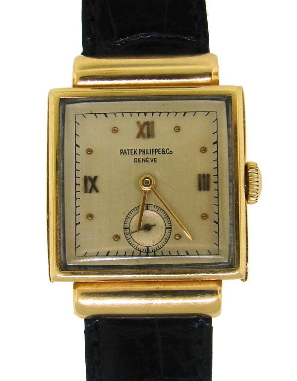 Classy and elegant watch crafted by Patek Philippe in circa 1940's. Rectangular face, yellow gold case, champagne color dial, separate second hand, gold Roman numerals, original black leather crocodile strap. Mechanical movement.<br />
The case