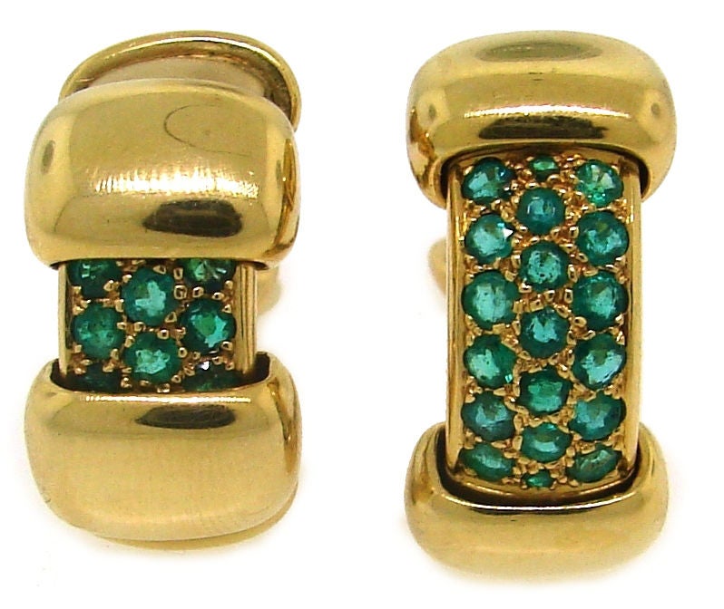 Exquisite vintage Peek-A-Boo earrings created by Rene Boivin in the 1950's. They are made of yellow gold and set with round cut emeralds. The peekaboo effect makes the earrings transform from  just a gold version into a gold & emerald pave version.