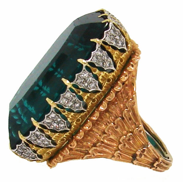 Fantastic Green Tourmaline & three tone gold with diamond accents ring was created by Buccellati in the 1970's.<br />
The ring is size 6 and can be sized if necessary.<br />
Green tourmaline measures 1 1/8