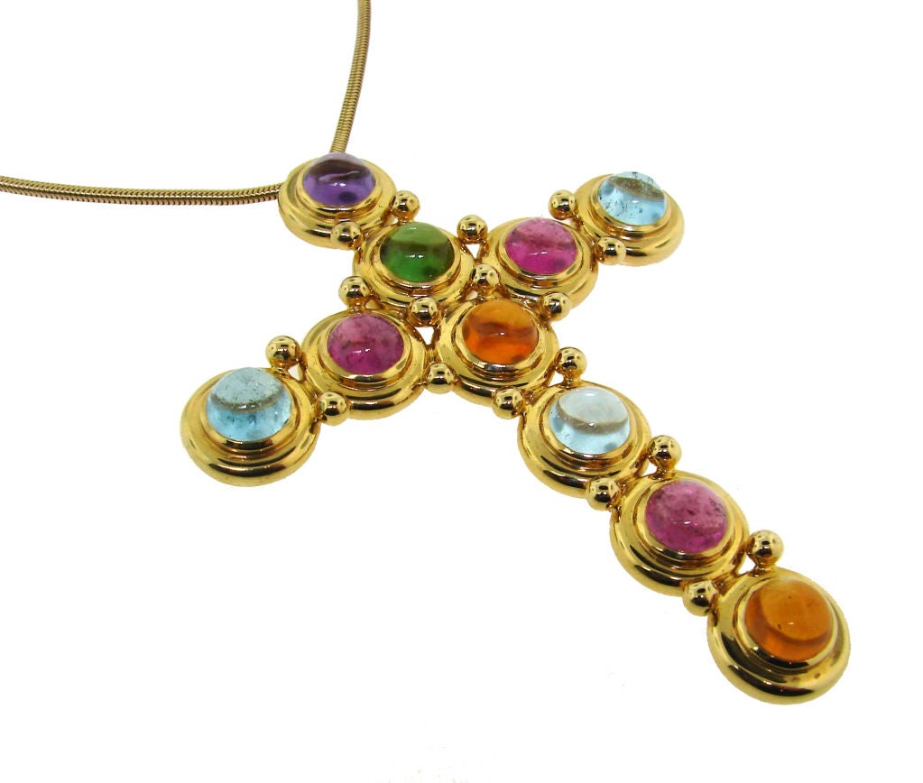 Stunning colorful and bold as all Paloma Picasso designs! This gems and yellow gold cross necklace was made by Tiffany & Co. in the 1980's. It's a great compliment to any casual outfit and some evening ones.<br />
The chain is 18