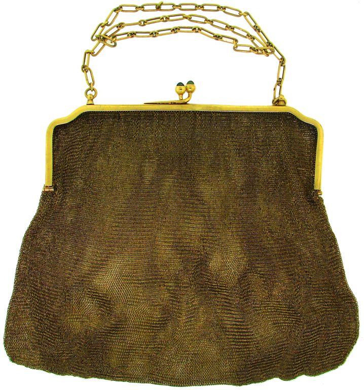 This fabulous antique golden mesh purse was created by Van Cleef & Arpels in the 1900's. There are two cabochon sapphires set in the clasp of the purse. It would be such a cute and stylish accent in a fashionista's wardrobe.