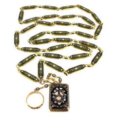 An Antique black and white enamel chain