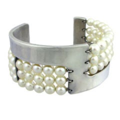 An Art Deco pearl and silver cuff bracelet
