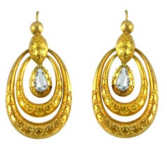 A pair of Etruscan Revial gold and aquamarine earrings.