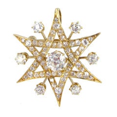 An antique gold and diamond cluster pendant