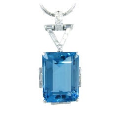 A Retro diamond pendant set with an aquamarine