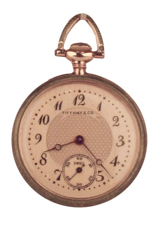 Tiffany and Co. 18kt.yellow gold ladies pendant watch in bronze color guilloche enamel case with platinum and diamond foliate overlay, the swiss 17 jewel movement was made for Tiffany and Co., with matching 26