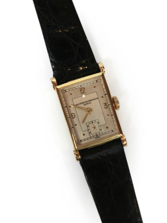 This is an elegant, rectangular shaped men's watch.