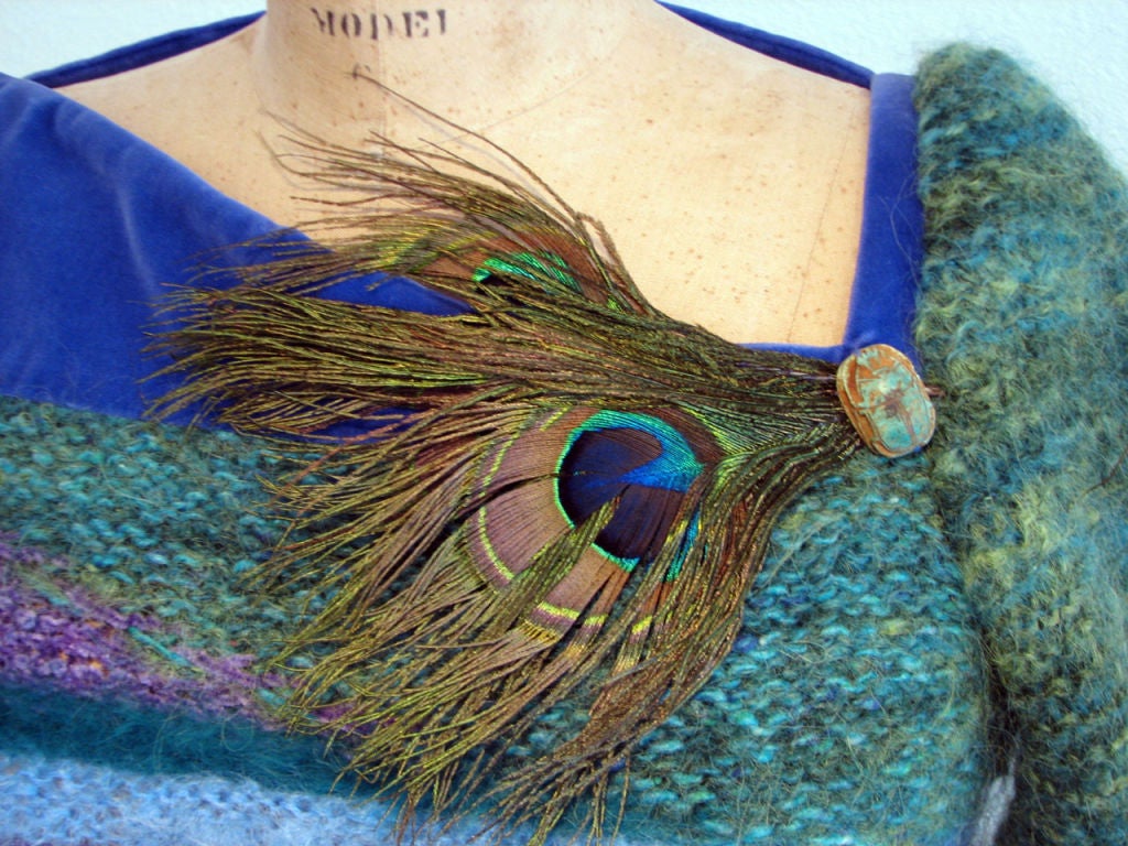 Fine hand made Dawn Wain 'art to wear' knit sweater. Fine silk & fur knit fabric item with velvet asymmetrical neckline, peacock feather/ceramic 'scarab' front detail. Item labeled size L & appears to fit a modern US size 8.