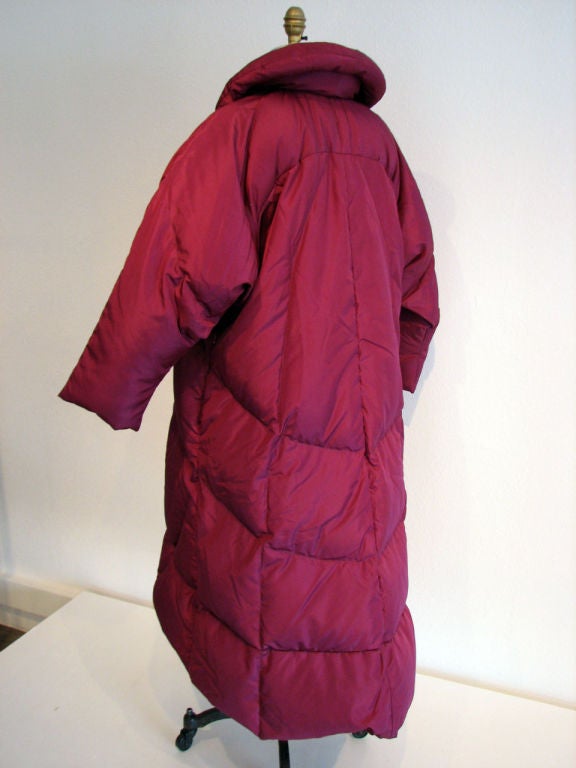 Fine & rare vintage Horsefeathers sculpted & quilted 'Puffy'/'Sleeping Bag' coat. Authentic 1970s item designed by Mayme Snyder. Fine 100% goose down magenta Nylon fabric quilted item features tie front closures. 1 size all item with hidden side