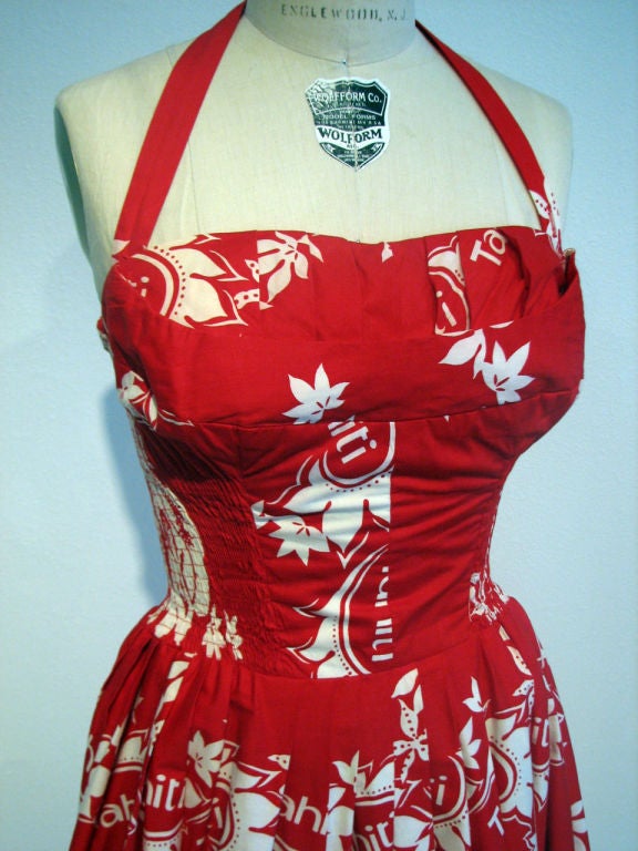 Fine & rare vintage Surf 'n Sand Hawaiian cocktail halter dress. Authentic 1950s item made in Hawaii. Outstanding & vibrant print red/white) item zips up back with button shoulder/neck strap. Item features 'shelf' bust line, nipped waist, pleated