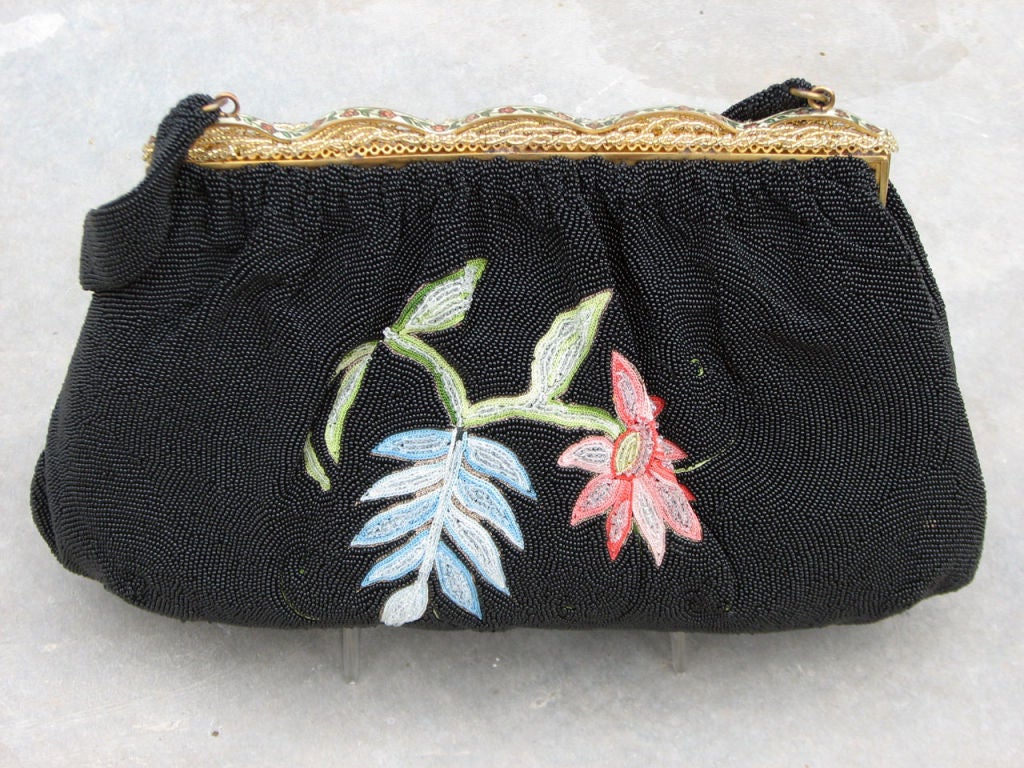 Fine vintage 'Floral' micro beaded evening hand bag. Authentic item fully micro glass beaded with gilt metal frame/hardware. 'Flip' closure & frame features enamel & additional beading. Interior fully silk lined with single open pocket & original