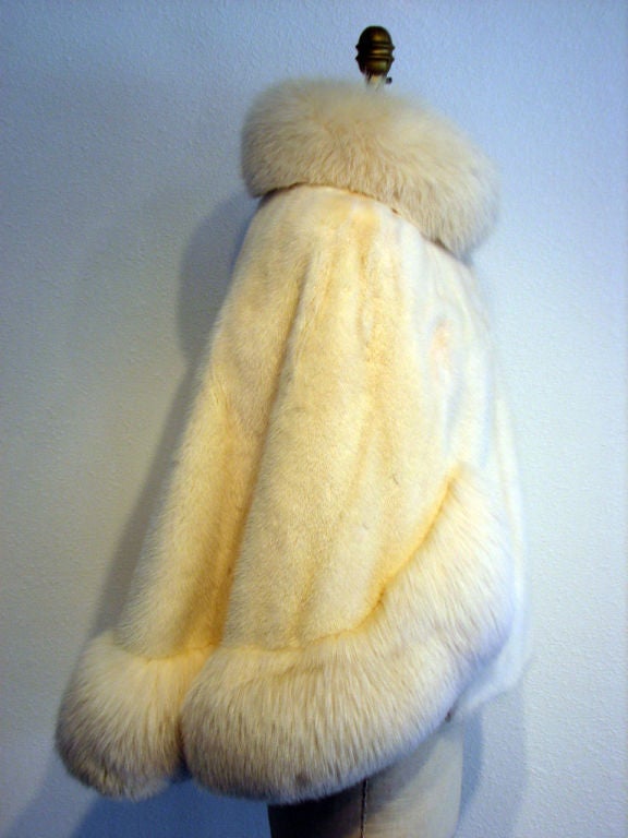 Fine & rare vintage Galanos Arctic fox & ivory mink fur 'Swing' coat/cape. Authentic item with no size label & appears to fit a range of modern US sizes 8-12. Finest Arctic fox & mink fur item fully silk lined with button front & single hook collar