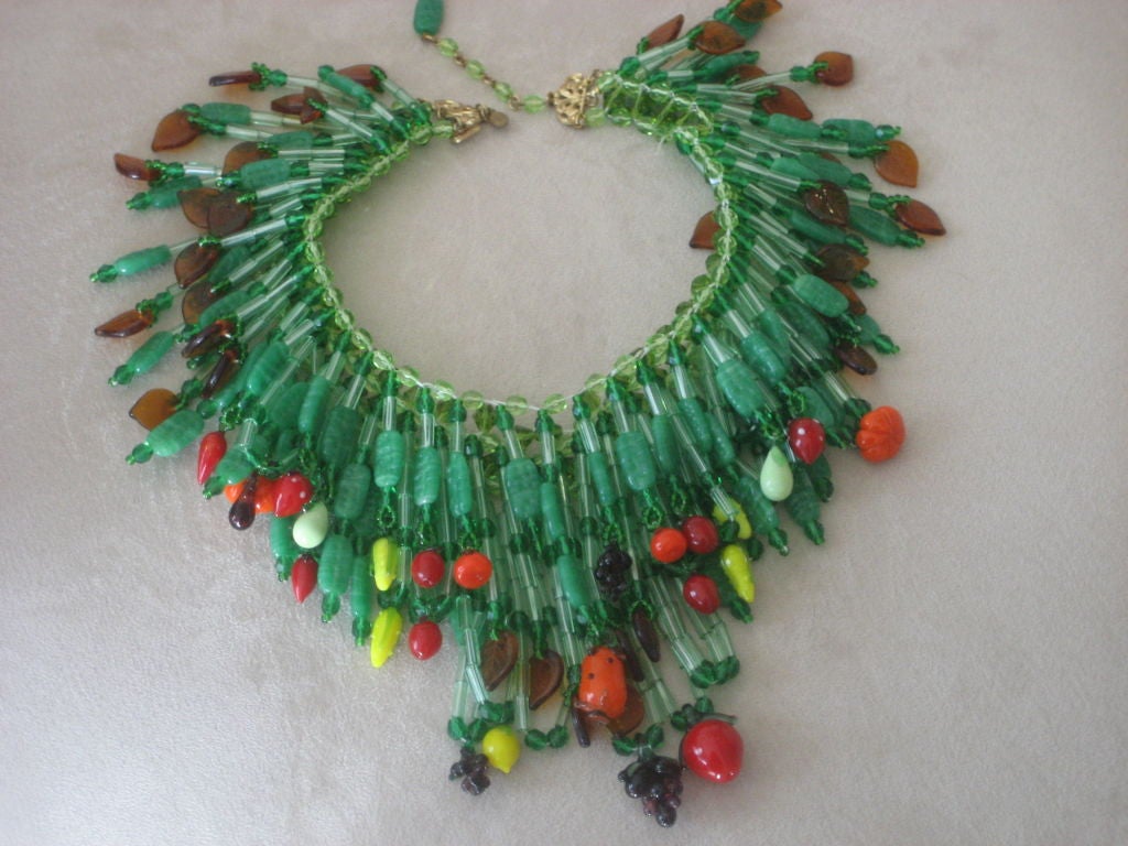 Dramatic glass beaded necklace by costume jewelry designer Ian St. Gielar- formerly with Stanley Hagler of NYC. This piece incorporates a series of glass tendrils punctuated with colorful fruit. All in glass- a classic with original brass tag.