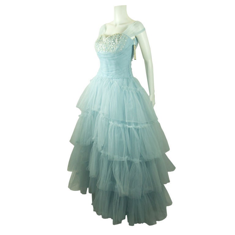 Featured is a beautiful 1950 shelf bust baby blue tulle party prom or wedding dress. This dress is layers and layers of tulle with soft tulle off the shoulders straps. Really a fabulous gown.
Measurements:

Bust: 33