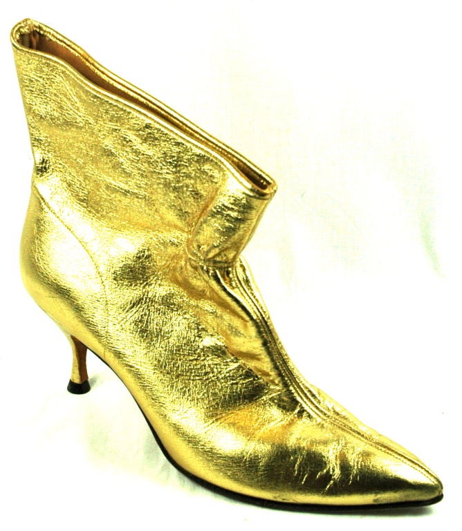 Featured are a pair of wonderful gold metallic booties. Size 8N