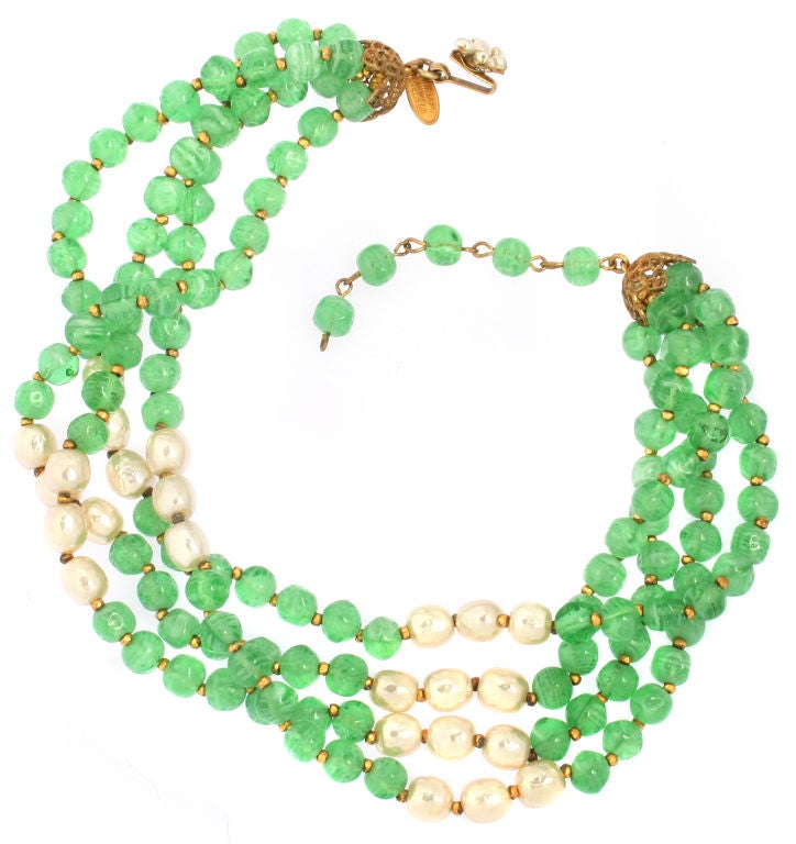 This is a great looking Haskell necklace.  The faux pearls and faux jade beads are set off by small gold tone beads. This necklace looks great by itself or can be layered with more pearls for a great look. The necklace measures 15 1/4 inches in