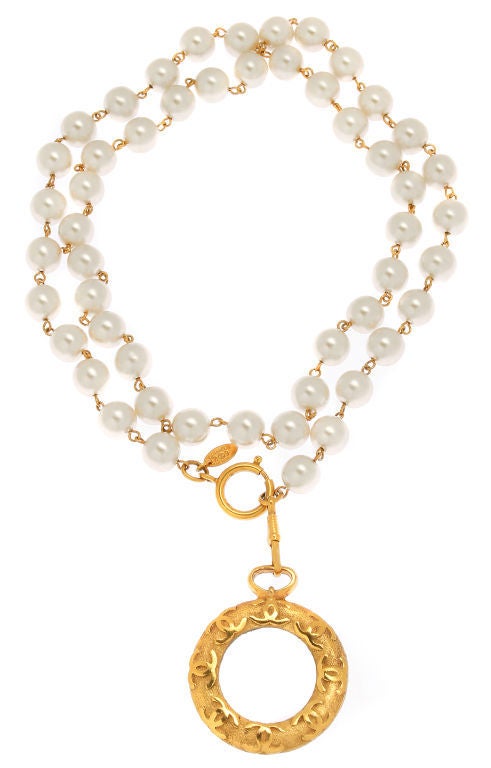 This is a great looking necklace by Chanel.  It has a nice size magnifyer that can be worn with the necklace, or detached. The necklace can be doubled aroung the neck or looks great layered with other pieces. *The chain measures 36